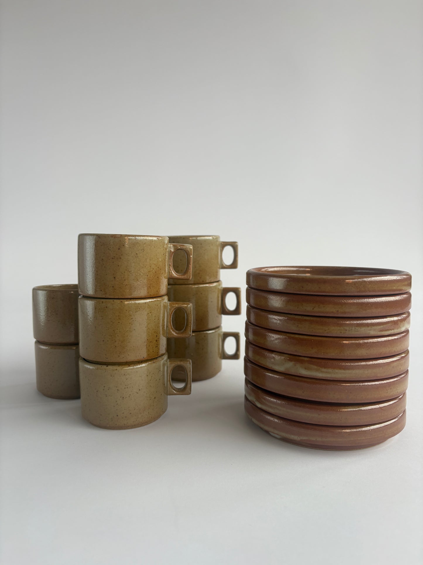 Set of 8 earthy stoneware cups with matching plates