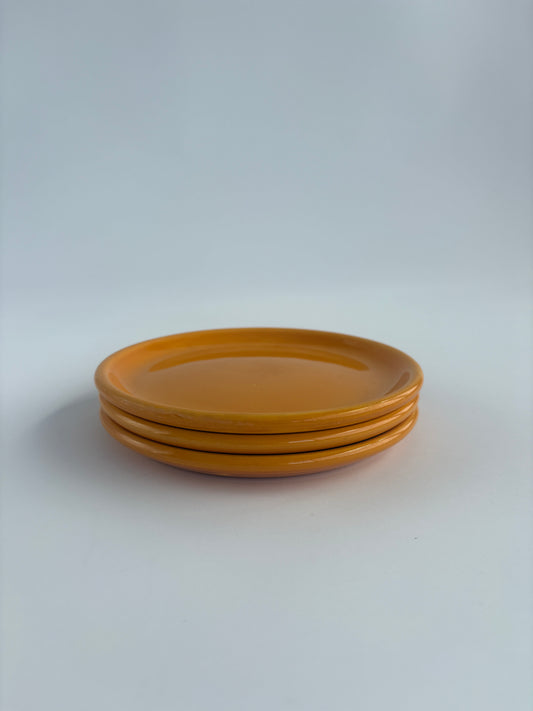 Set of 3 small bright orange plates