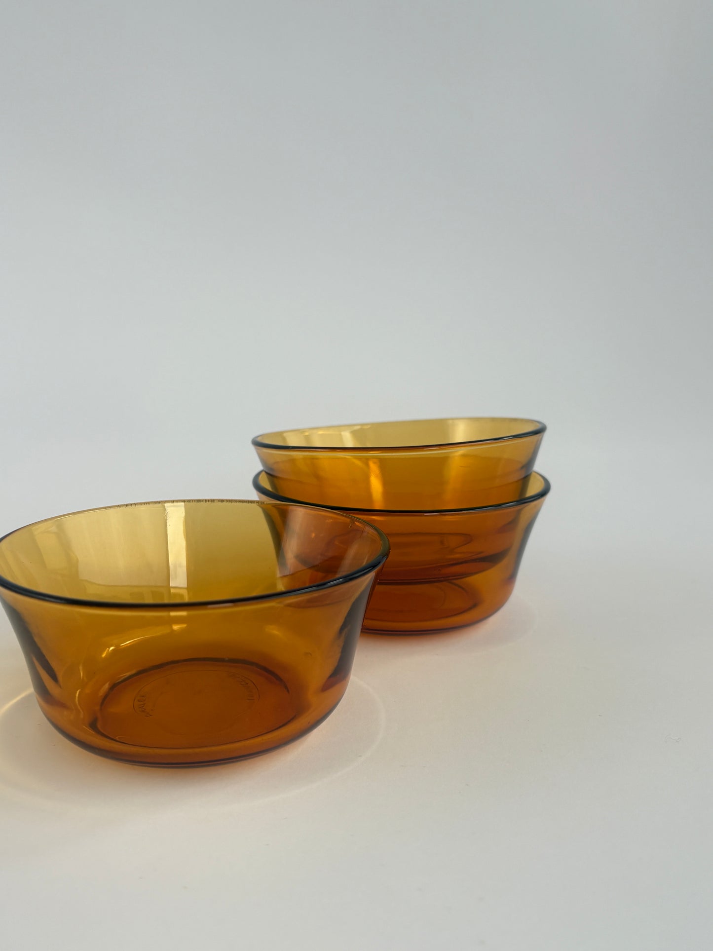 Set of 3 small amber glass bowls