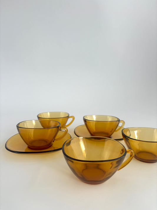 Vintage tea cups in amber