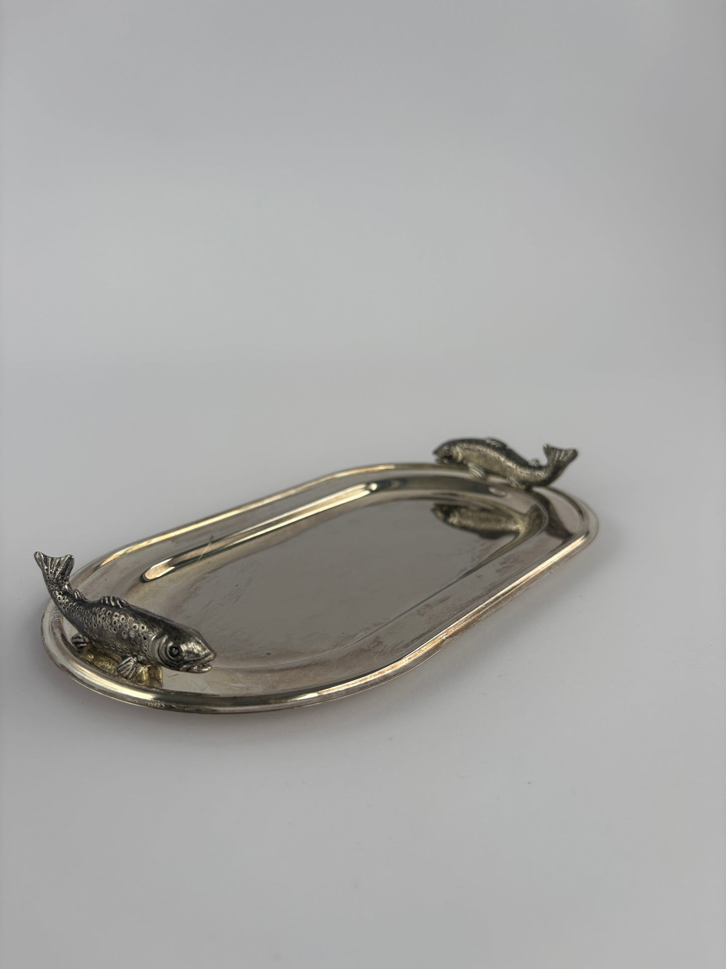 Small silver serving tray with fish decoration
