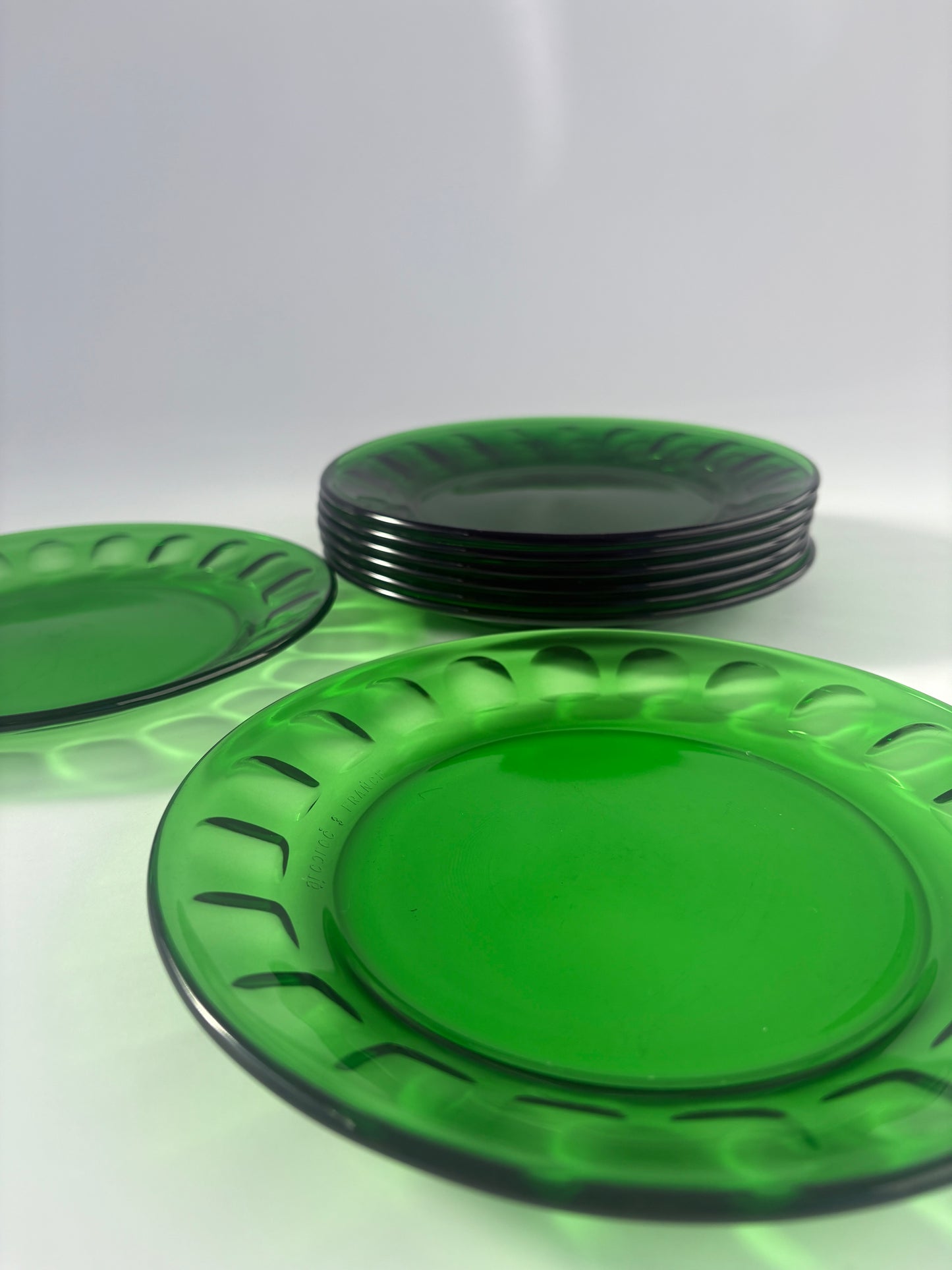Set of 8 small green glass plates