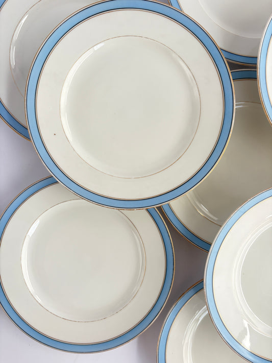 Set of 9 plates with blue and gold rim