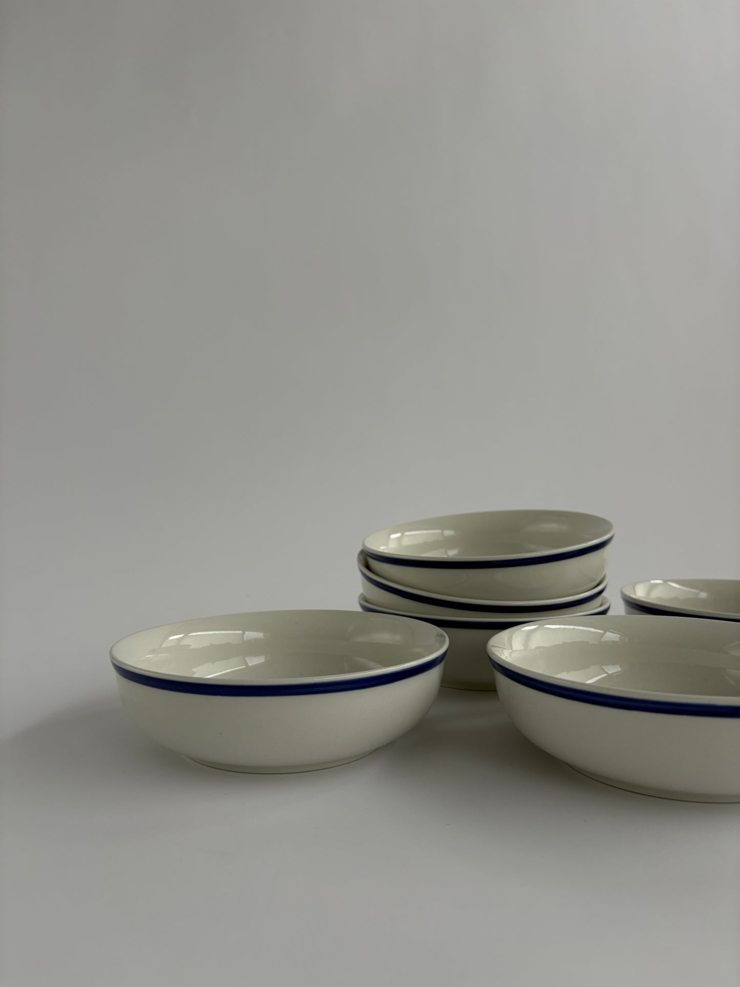 Set of 6 white bowls with blue rim