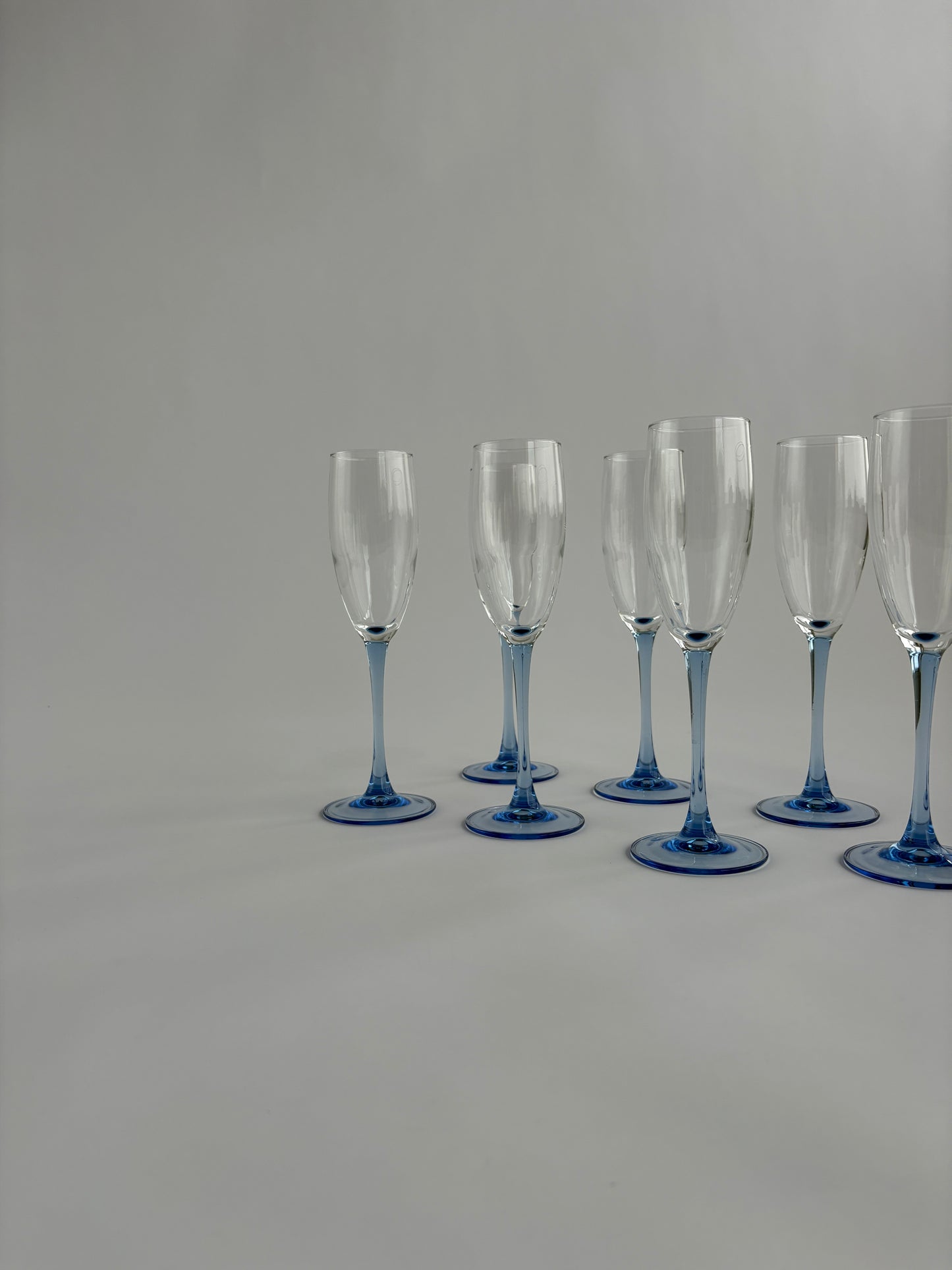 Set of 7 champagne glasses with blue stem