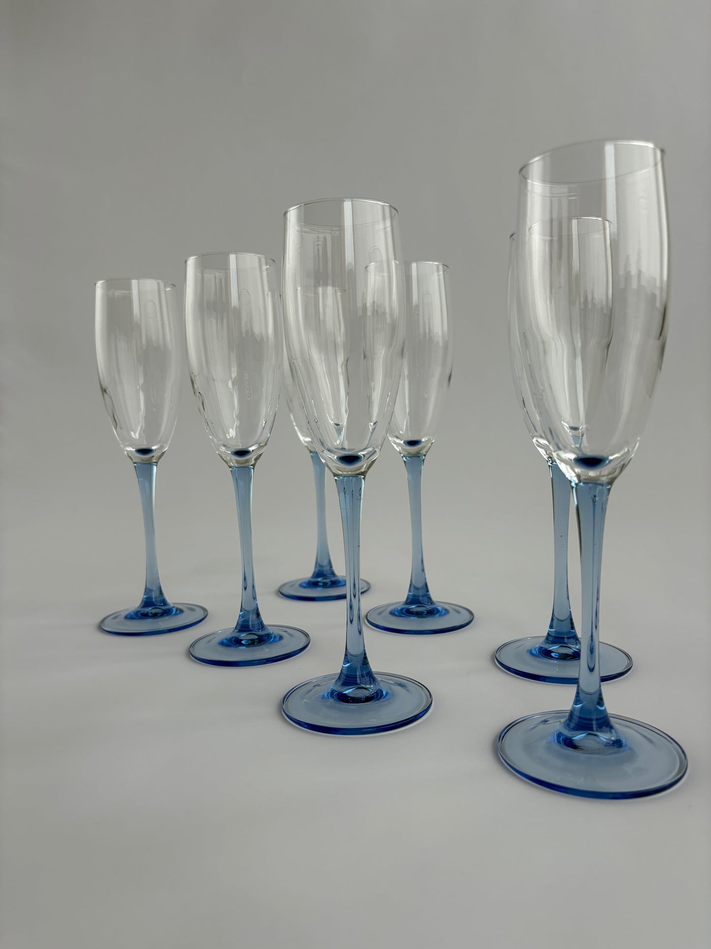 Set of 7 champagne glasses with blue stem