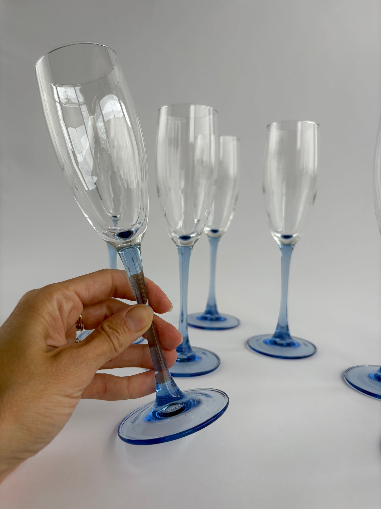 Set of 7 champagne glasses with blue stem