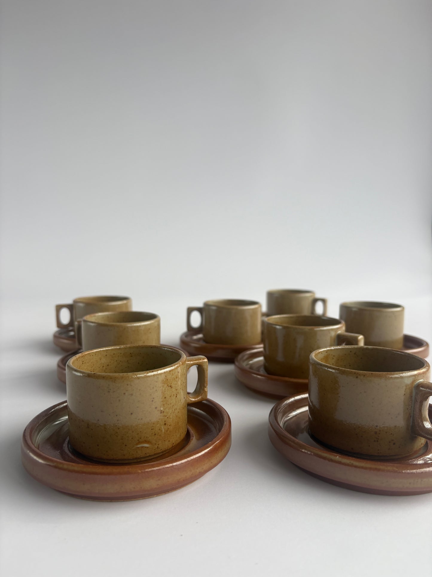 Set of 8 earthy stoneware cups with matching plates