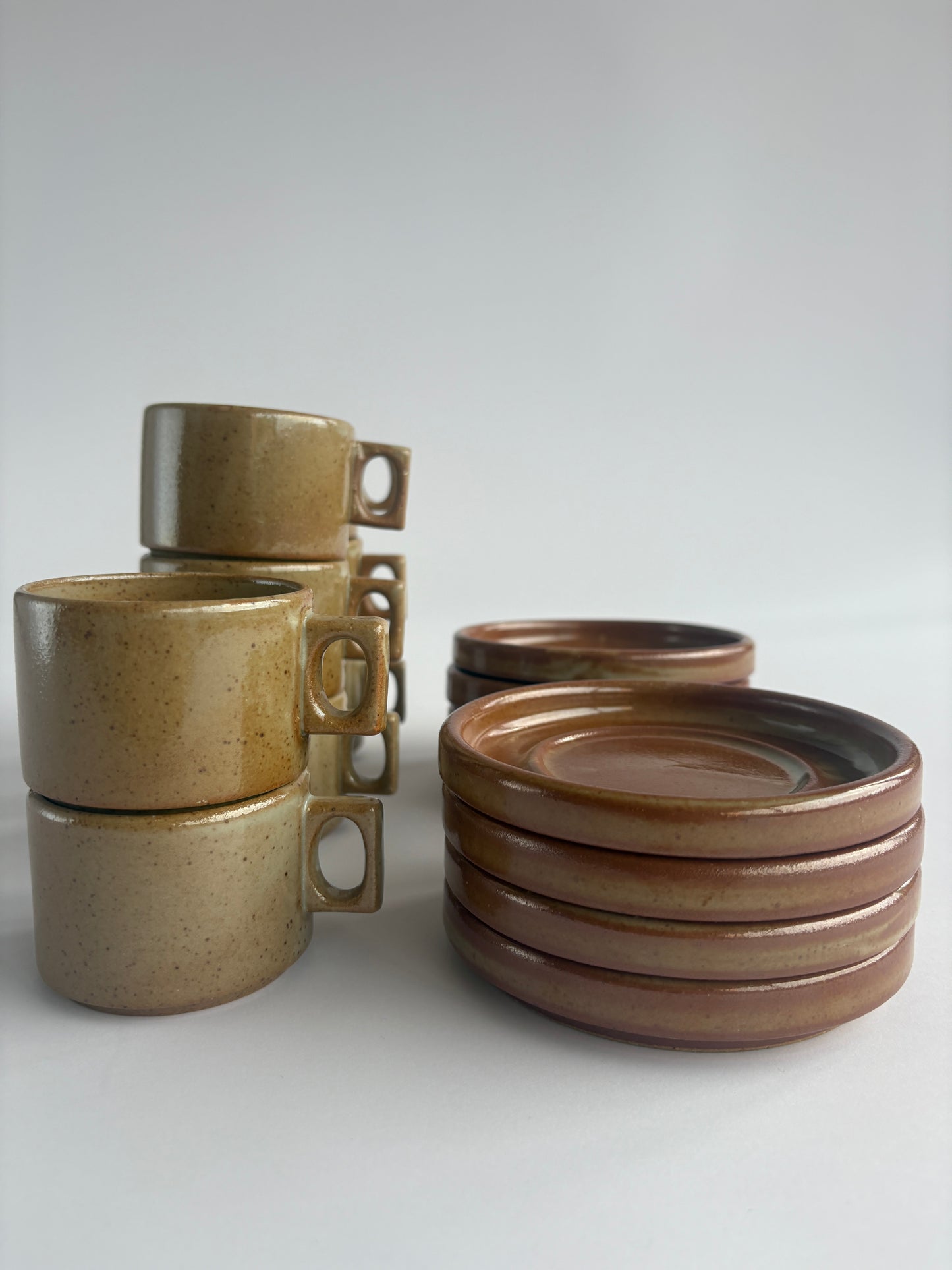 Set of 8 earthy stoneware cups with matching plates
