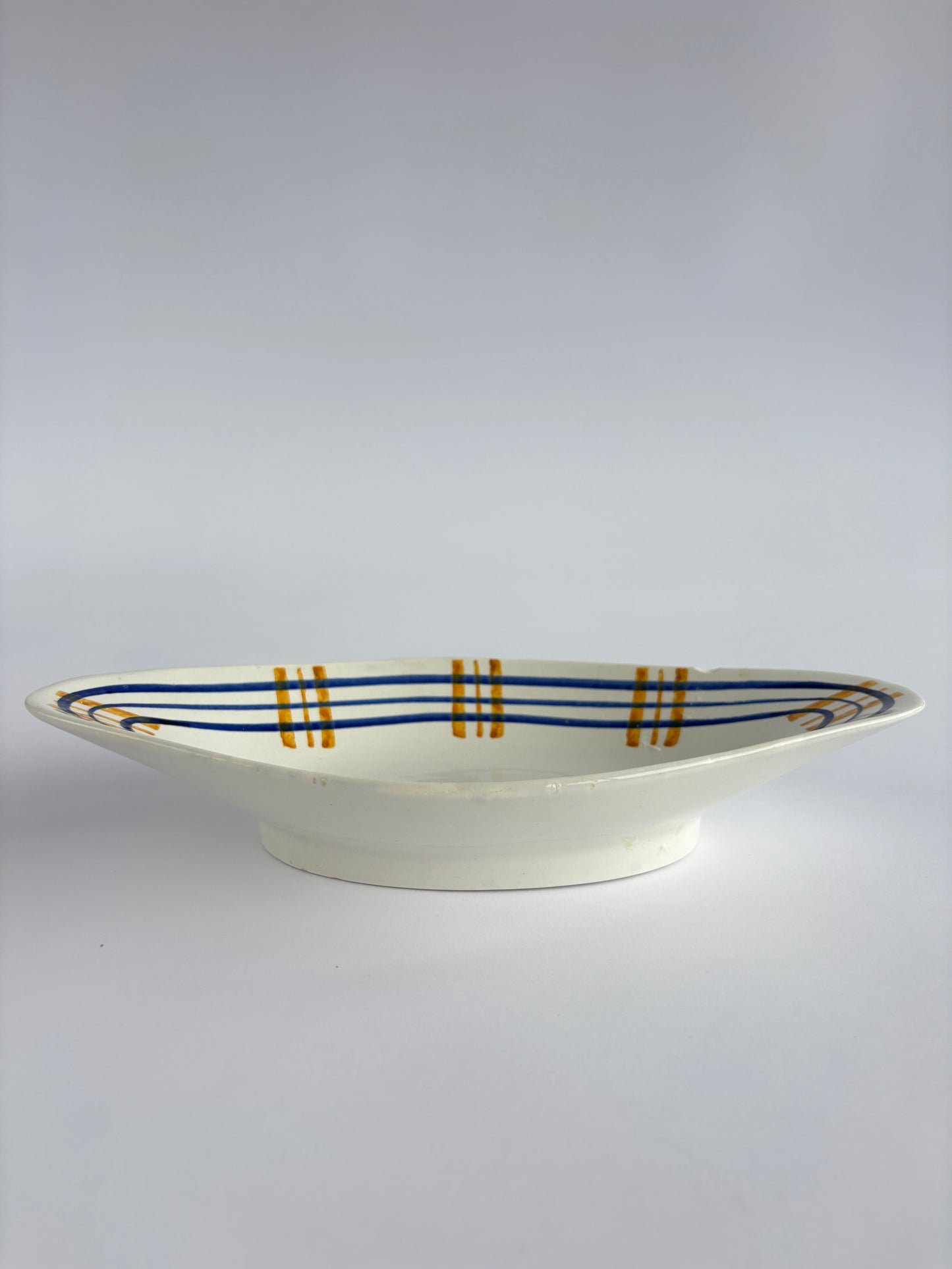 Small serving dish with blue & yellow stripes
