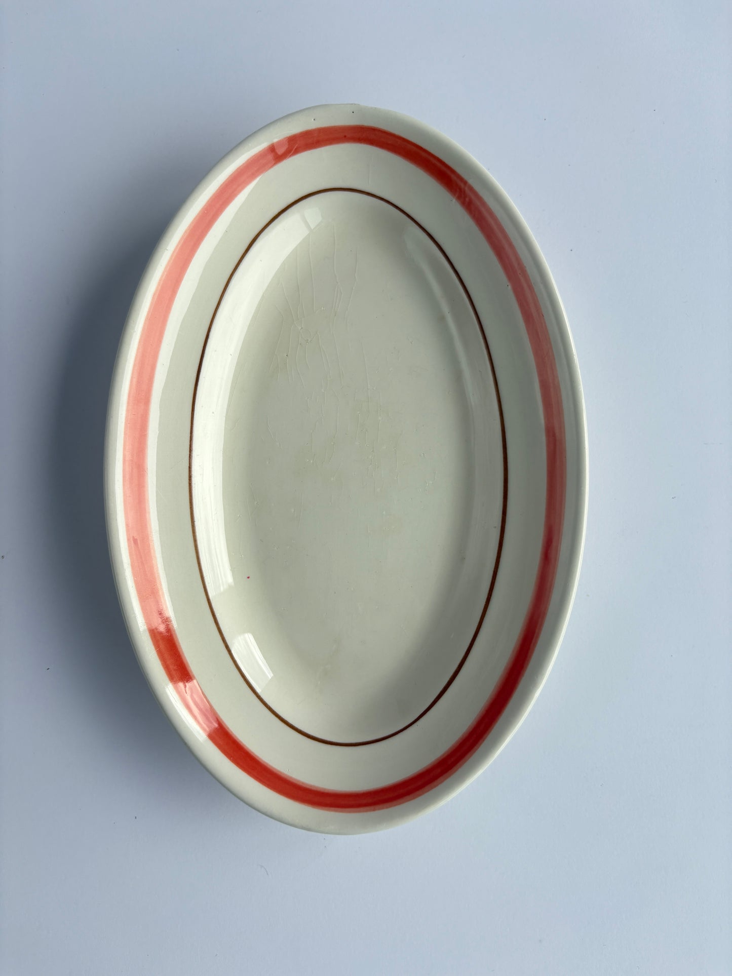 Small serving plate (ravier) with red rim