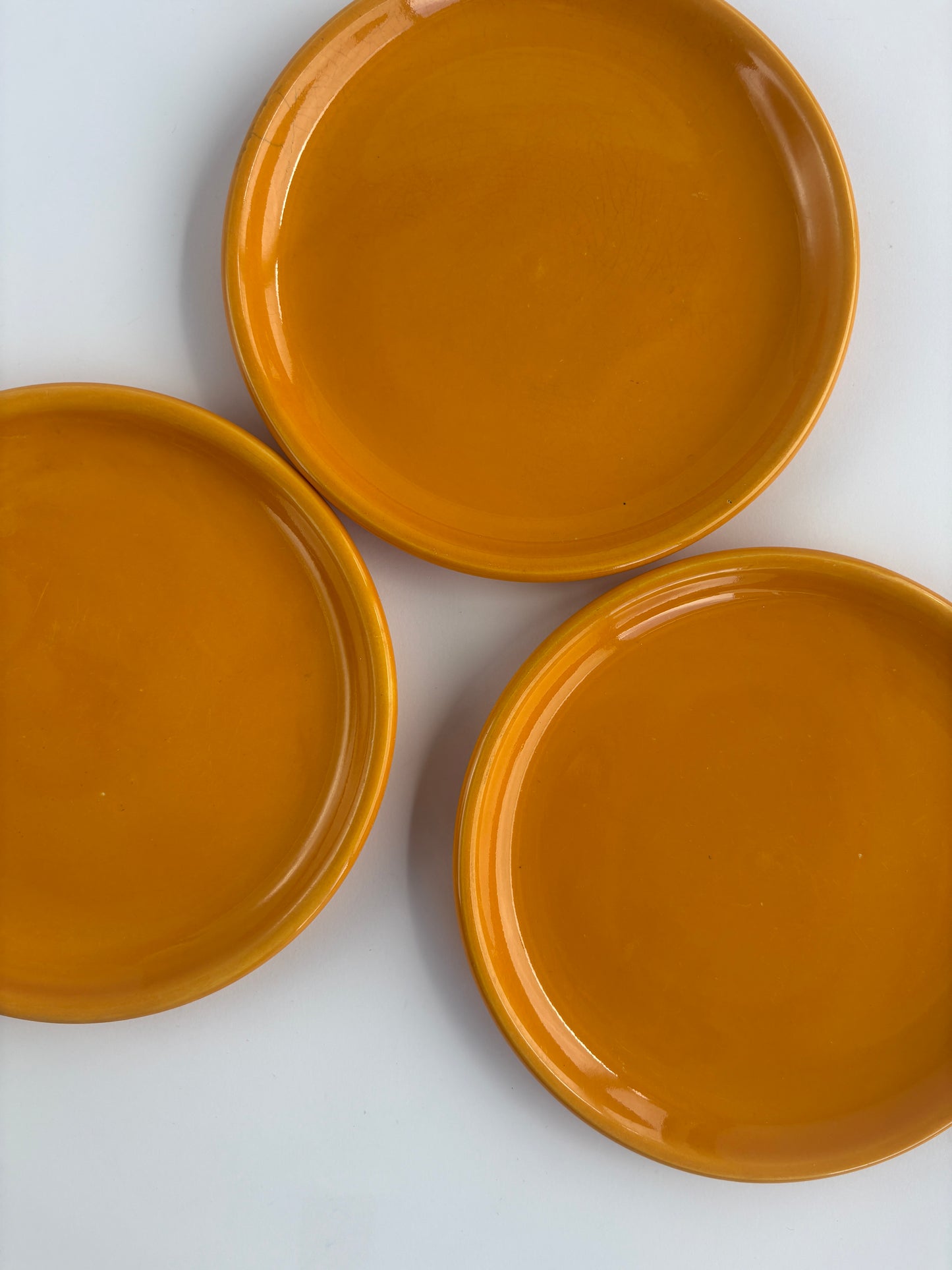 Set of 3 small bright orange plates