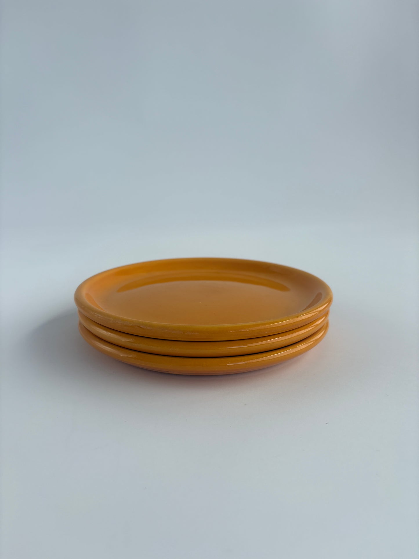 Set of 3 small bright orange plates