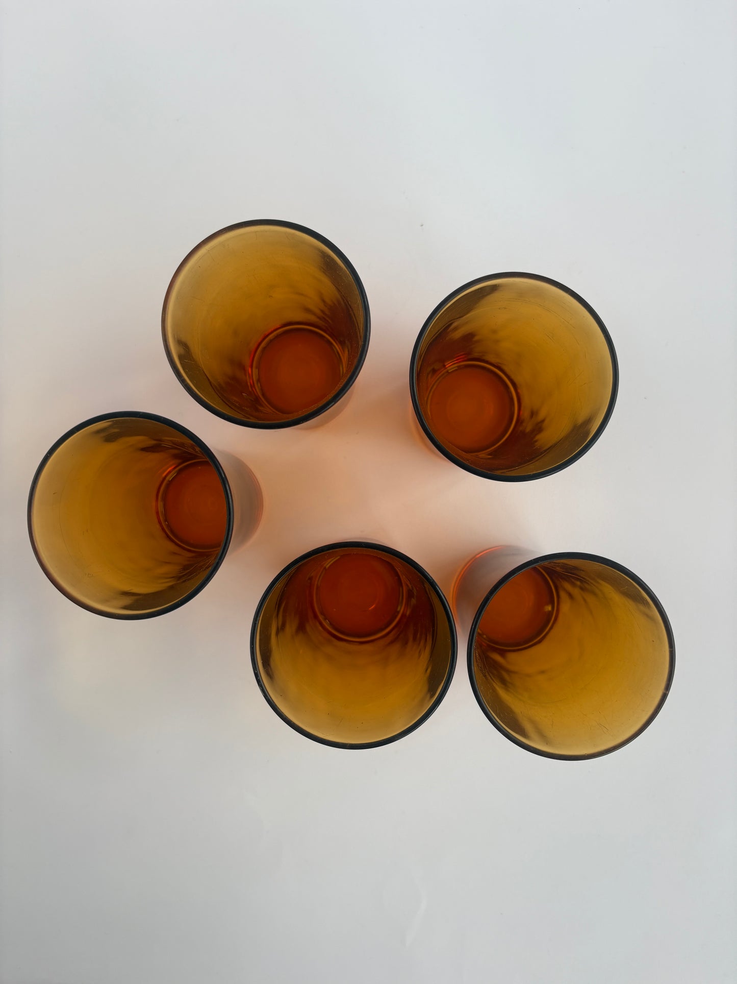 Set of 5 amber-colored long drink glasses