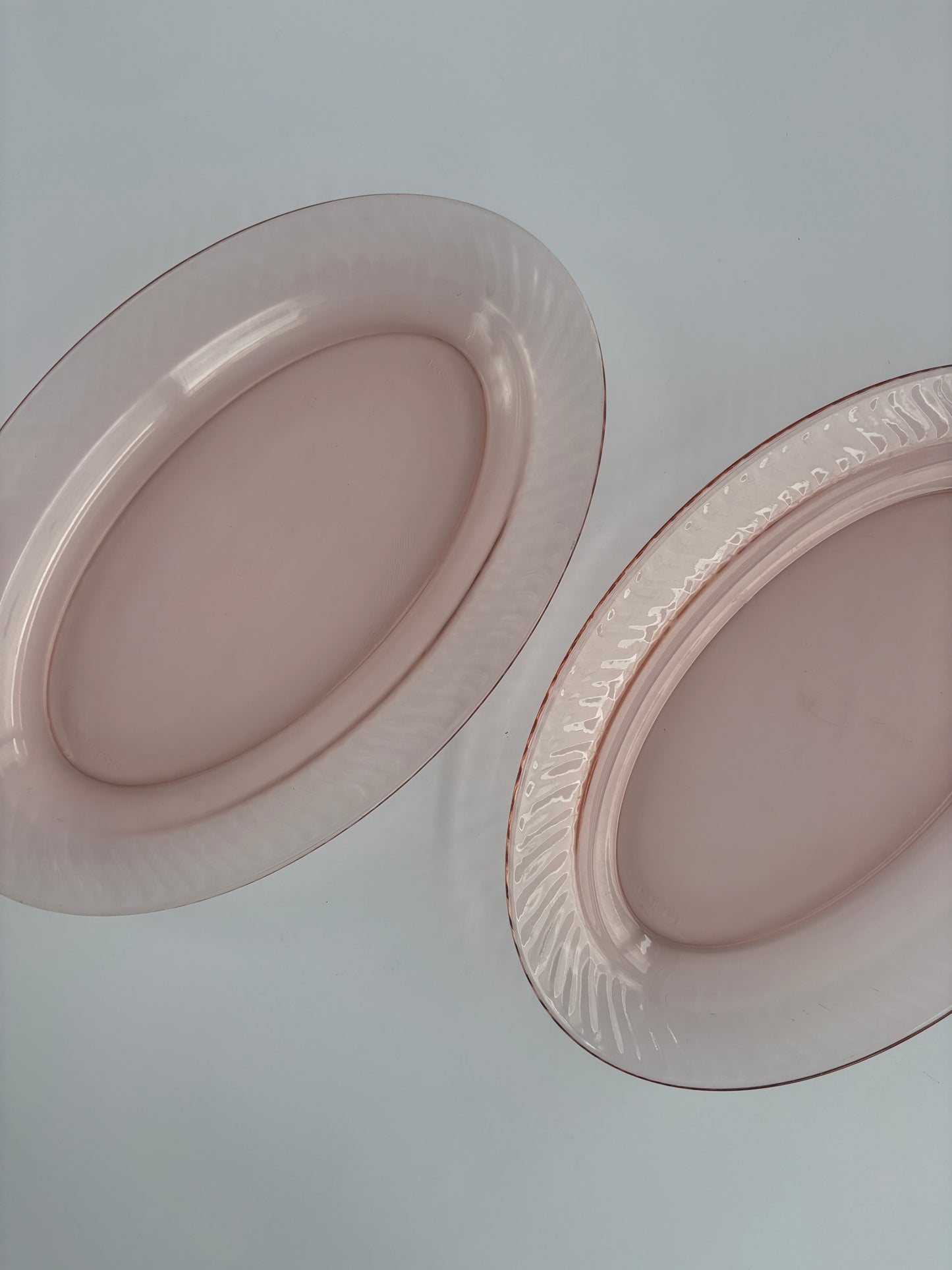 Set of two oval serving dishes, pink ribbed glass