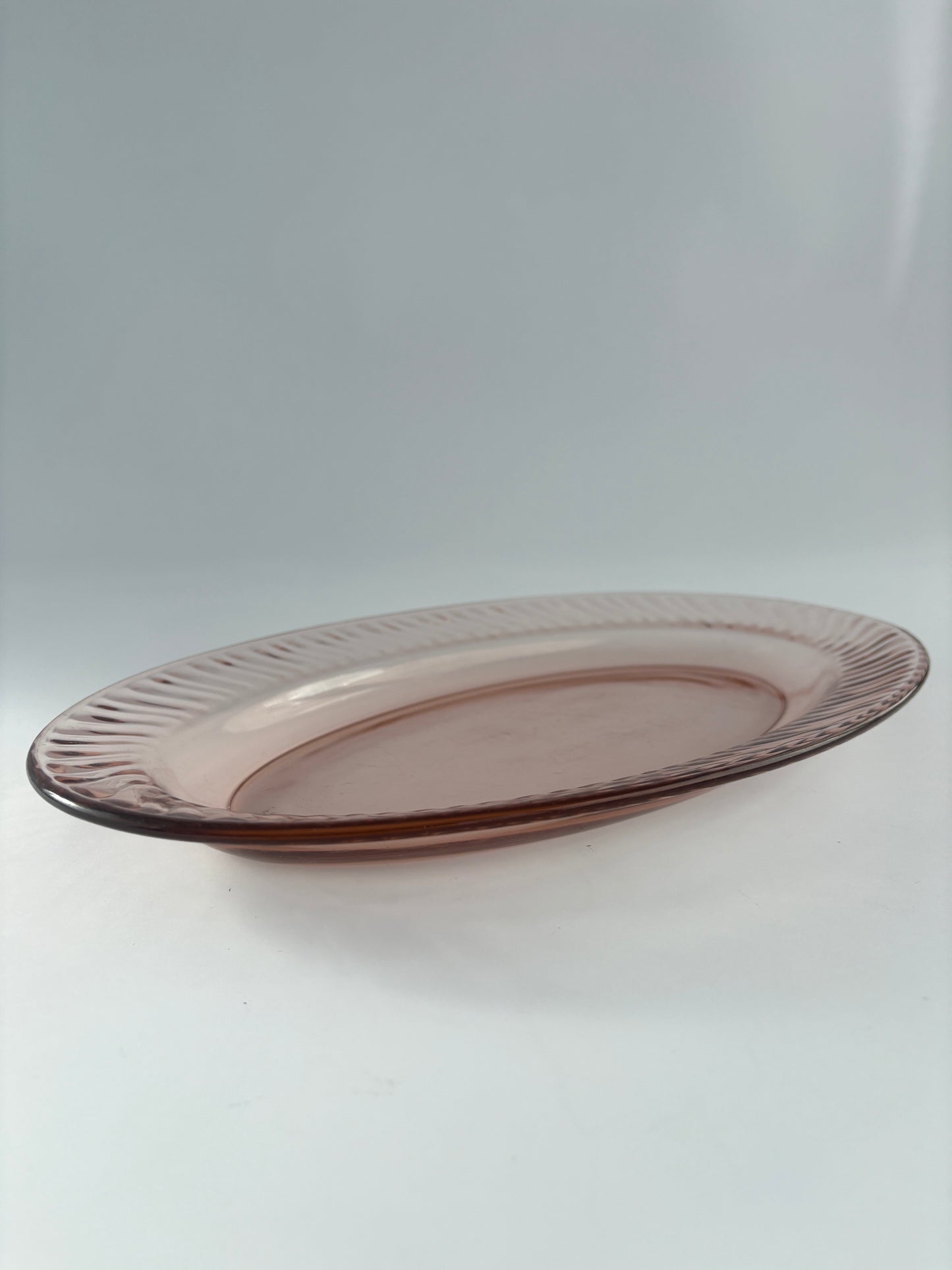 Set of two oval serving dishes, pink ribbed glass
