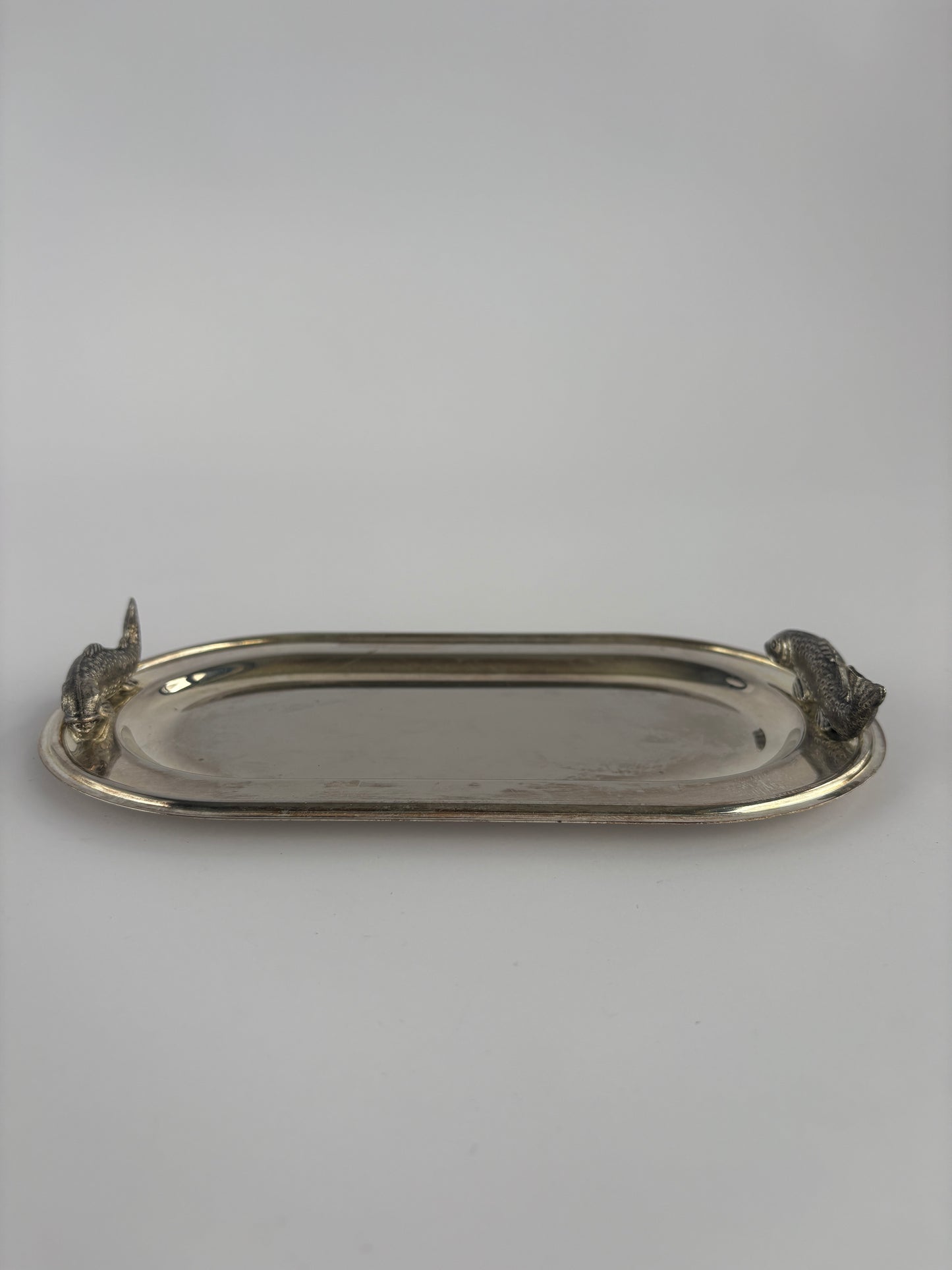 Small silver serving tray with fish decoration