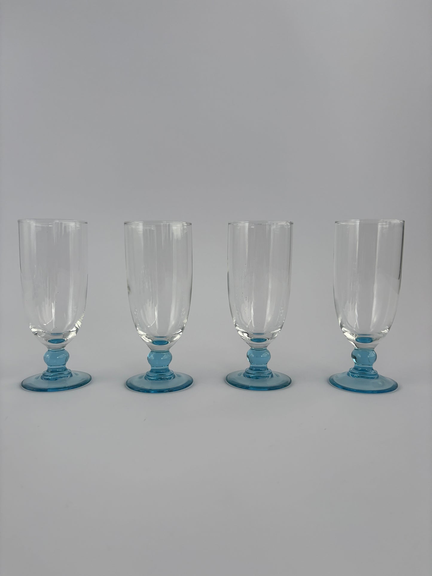Set of 4 champagne glasses with light blue stems