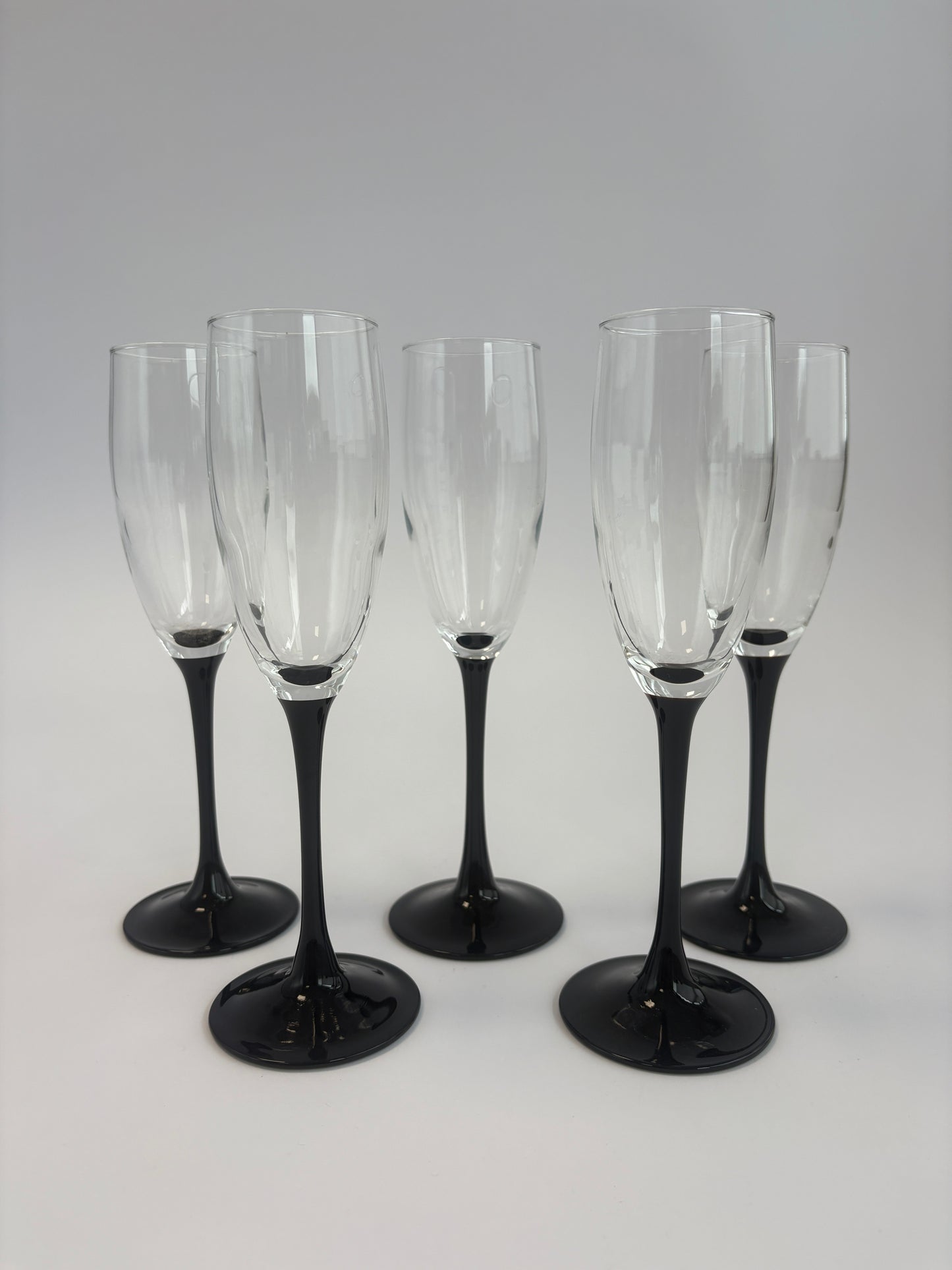 Set of 5 champagne glasses with black stems