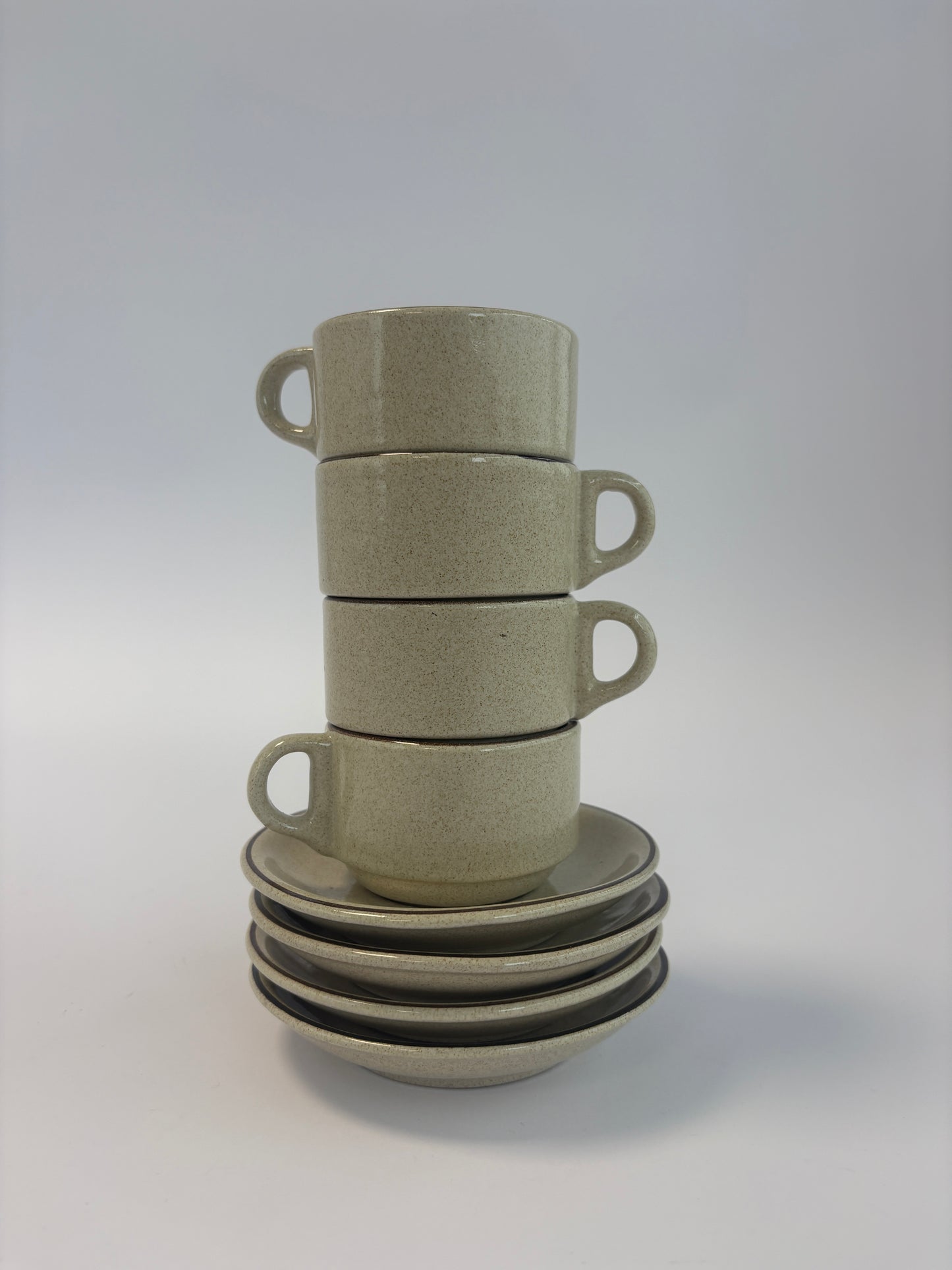 Set of 4 small coffee cups with saucers