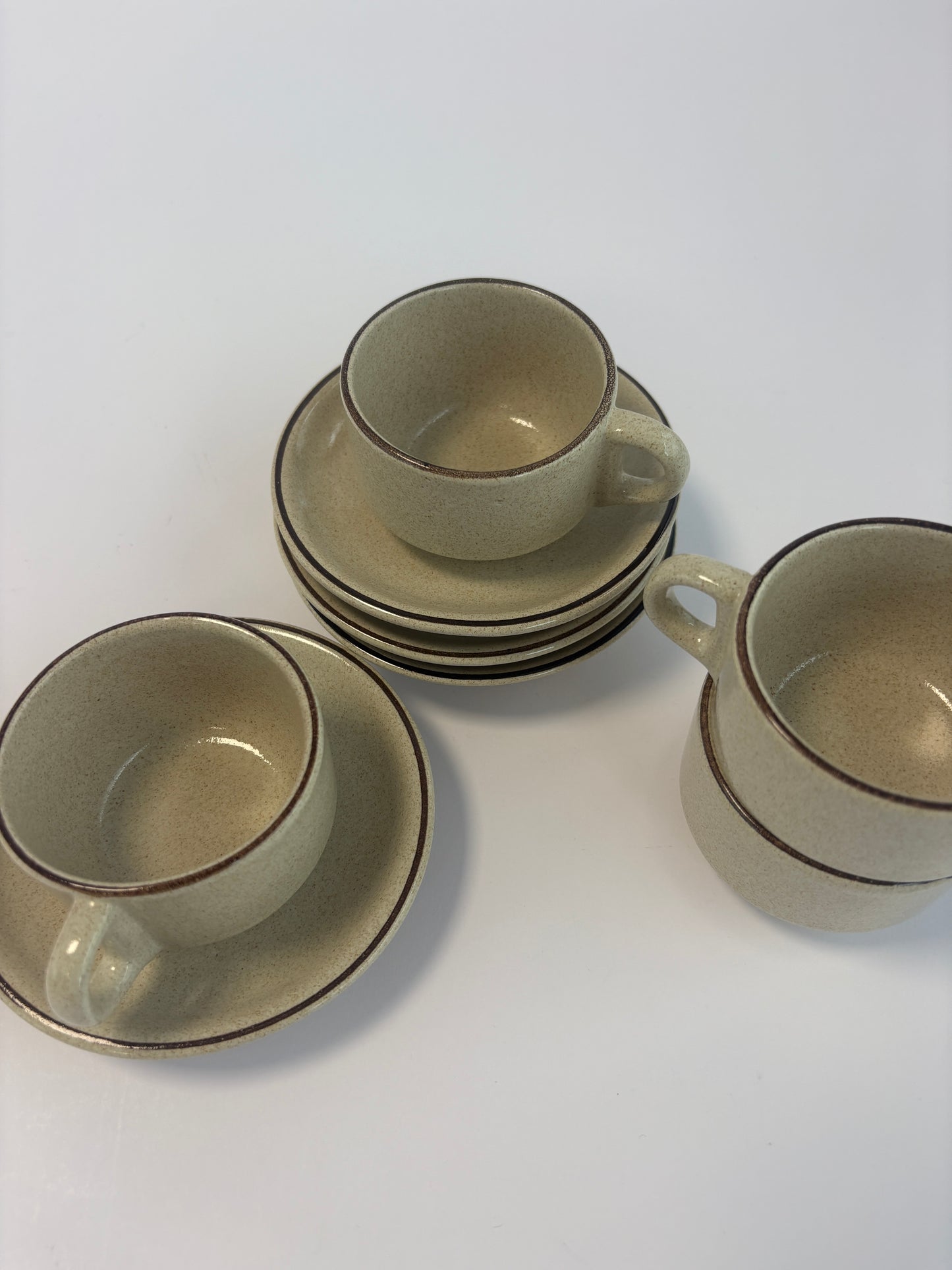 Set of 4 small coffee cups with saucers