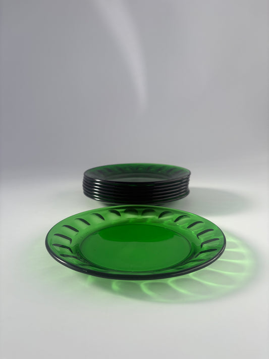 Set of 8 small green glass plates