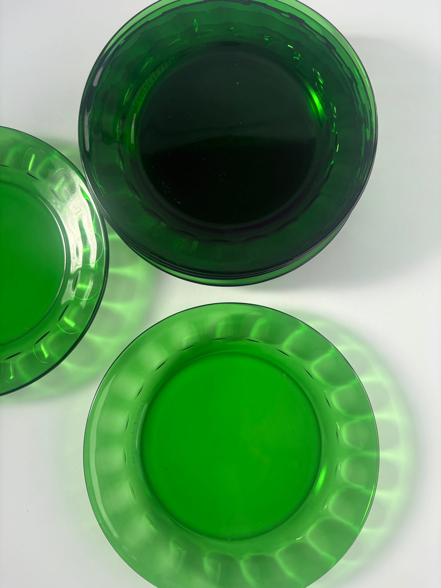 Set of 8 small green glass plates