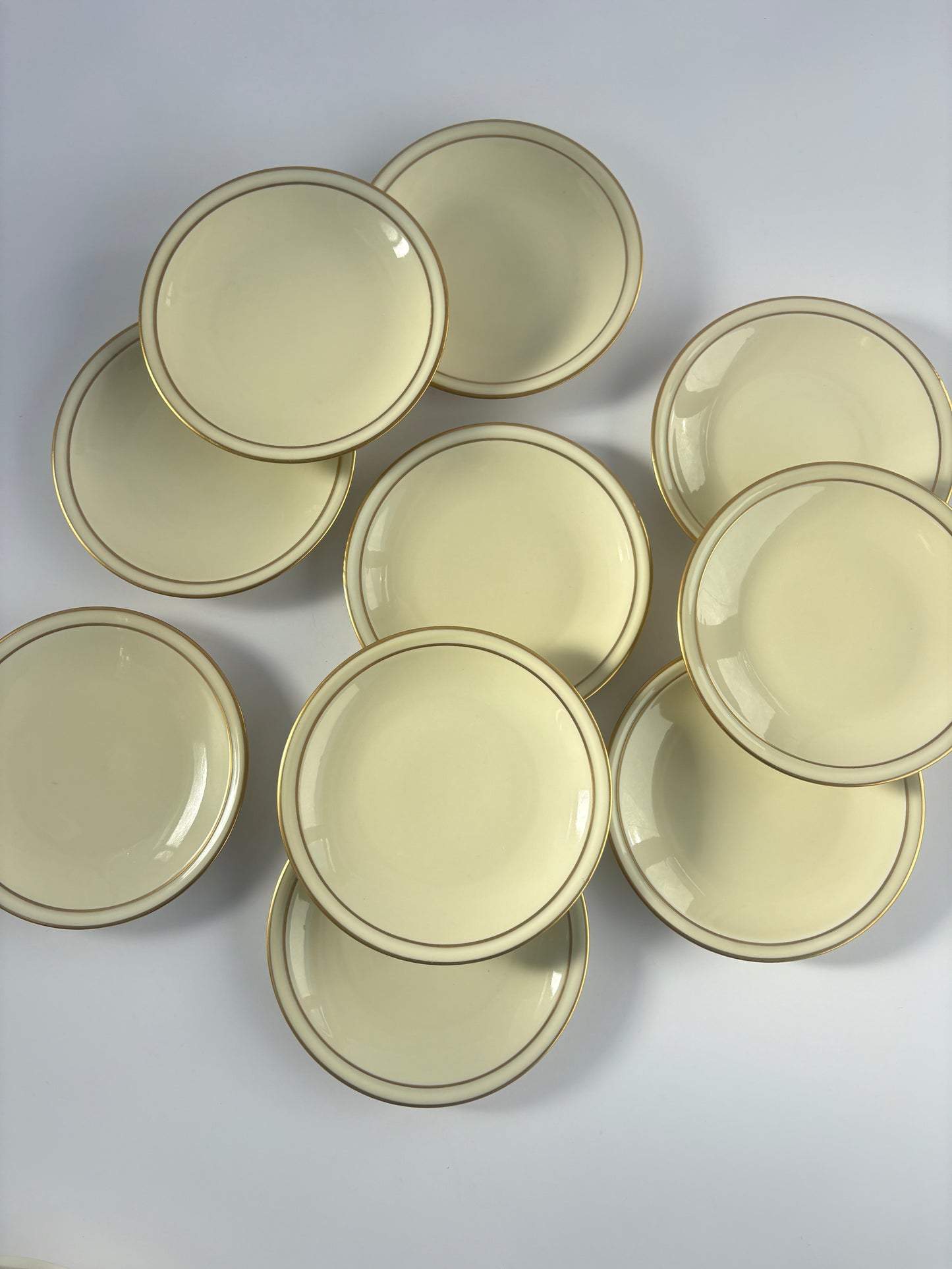 Set of 10 cream plates with double gold rim