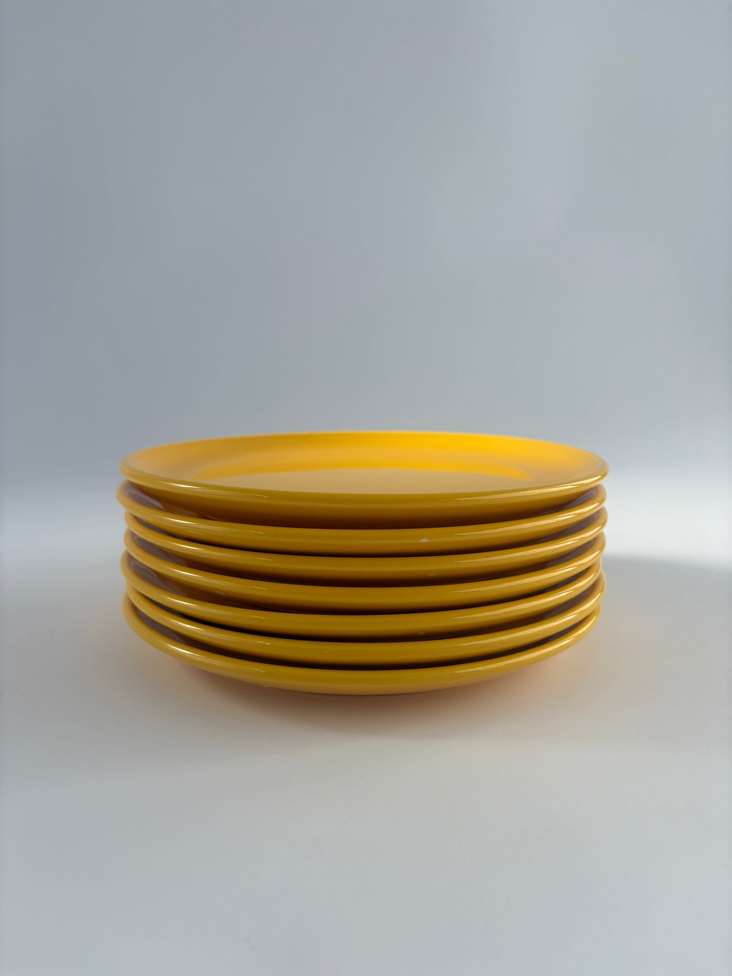 Set of 7 bright yellow plates