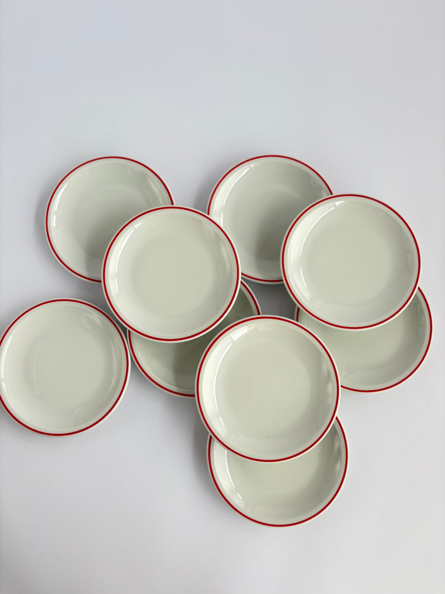 Set of 9 white snack plates with red rim