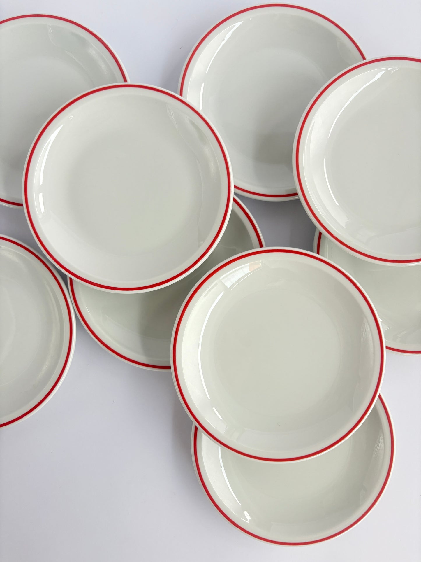 Set of 9 white snack plates with red rim