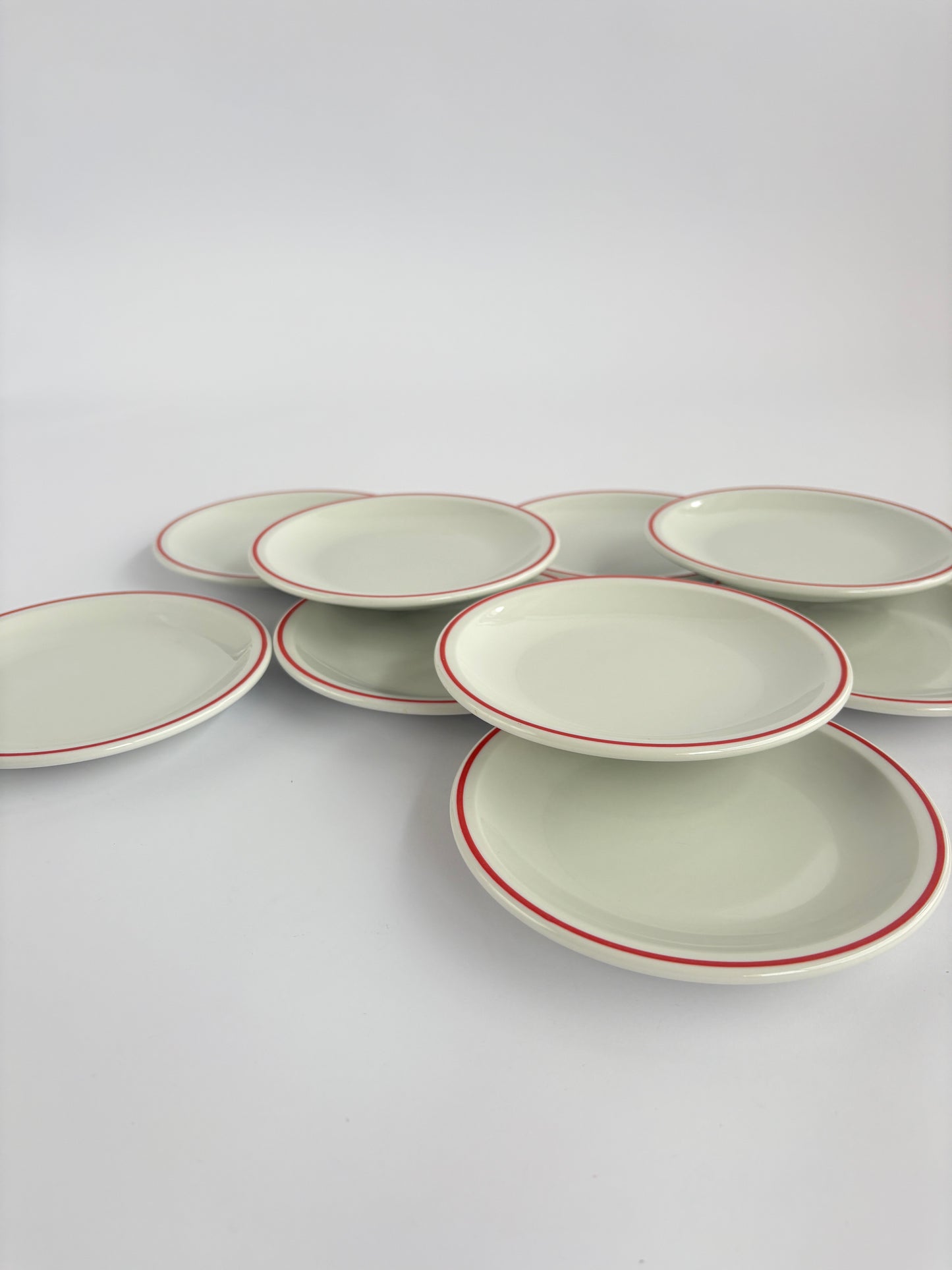 Set of 9 white snack plates with red rim