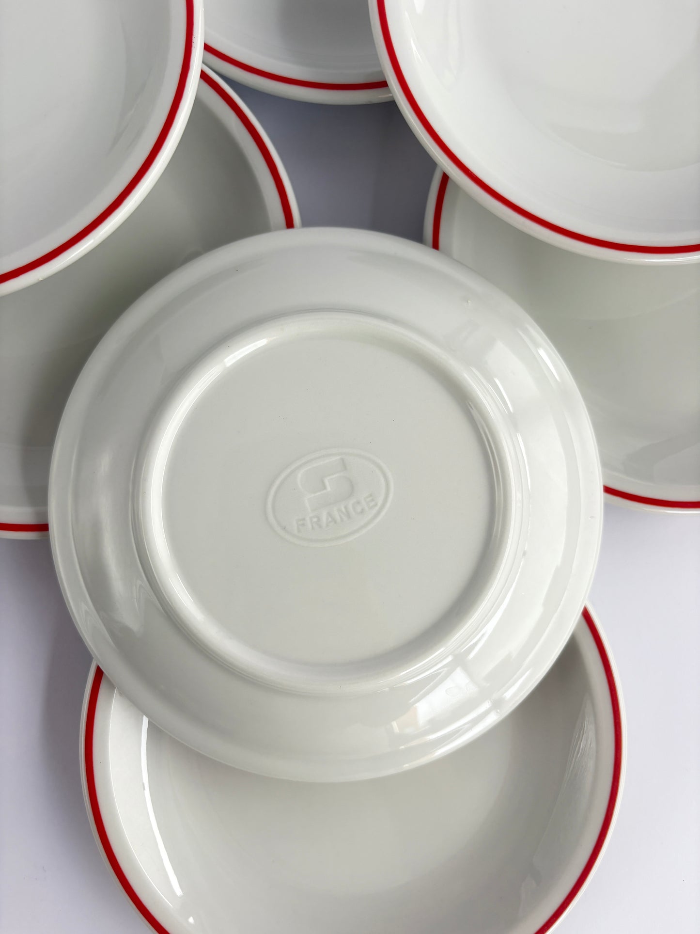 Set of 9 white snack plates with red rim